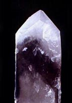 longitudinal  section  of smoky quarz show  band parallel to the external faces