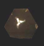 pinhole light-figures an etched section of quartz