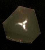 quartz etched surface section of crystal a pinhole light-figures