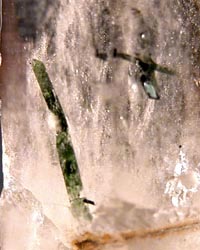 zinwaldite green  inclusions in quartz  baveno